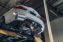 Load image into Gallery viewer, A view from under a BMW M4 of the ARK DT-S Exhaust System with Burnt Tips
